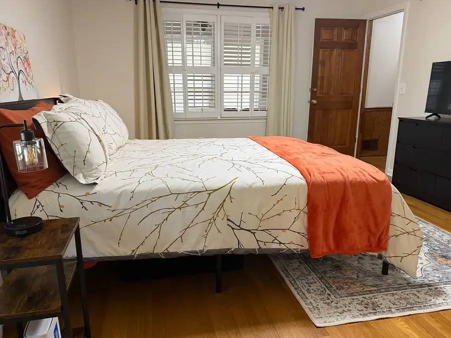 Bedroom with workspace and seating