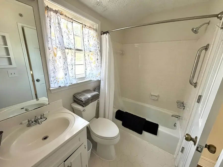 Full bathroom with tub and shower